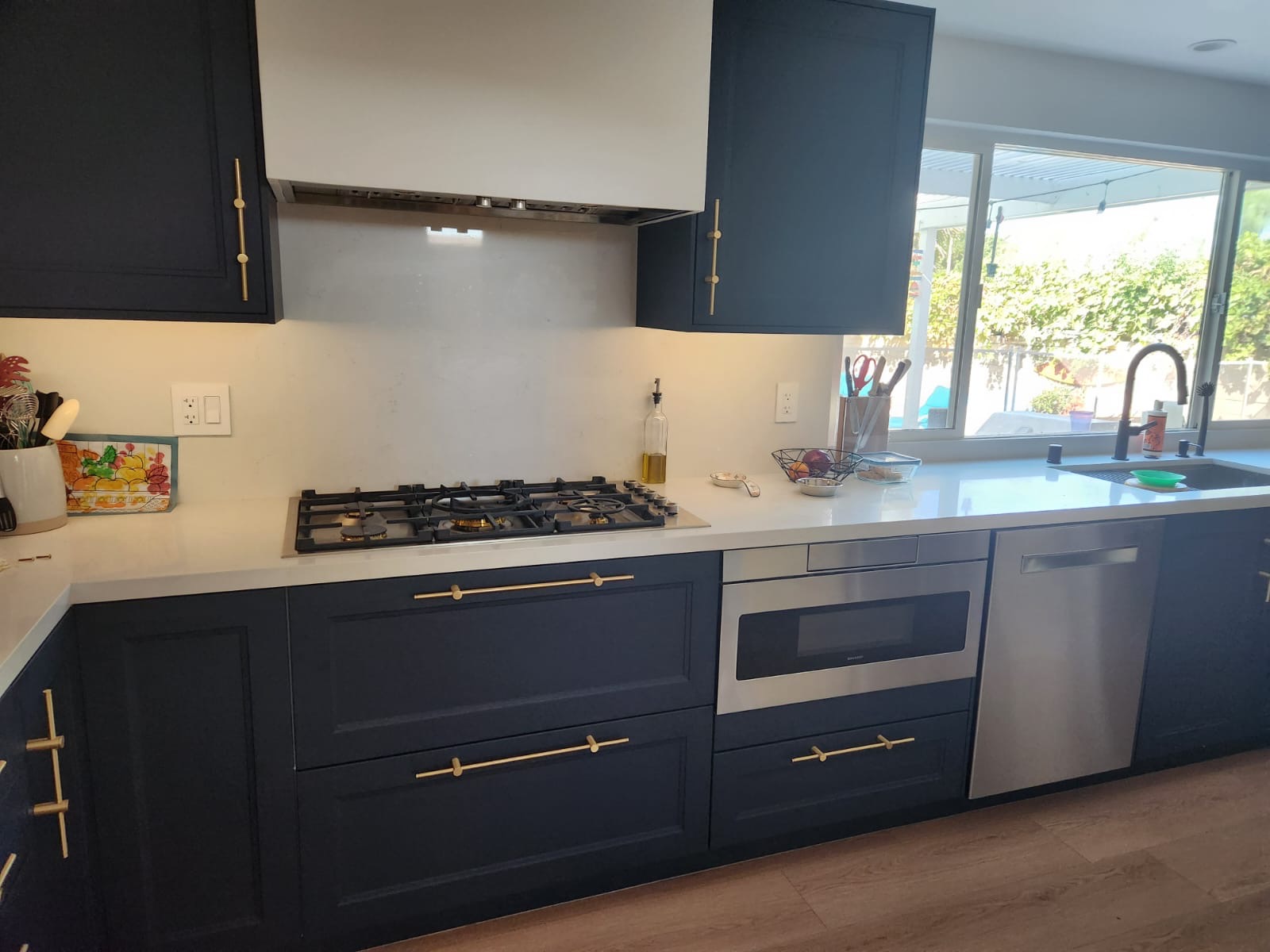 Navy cabinets with custom hood